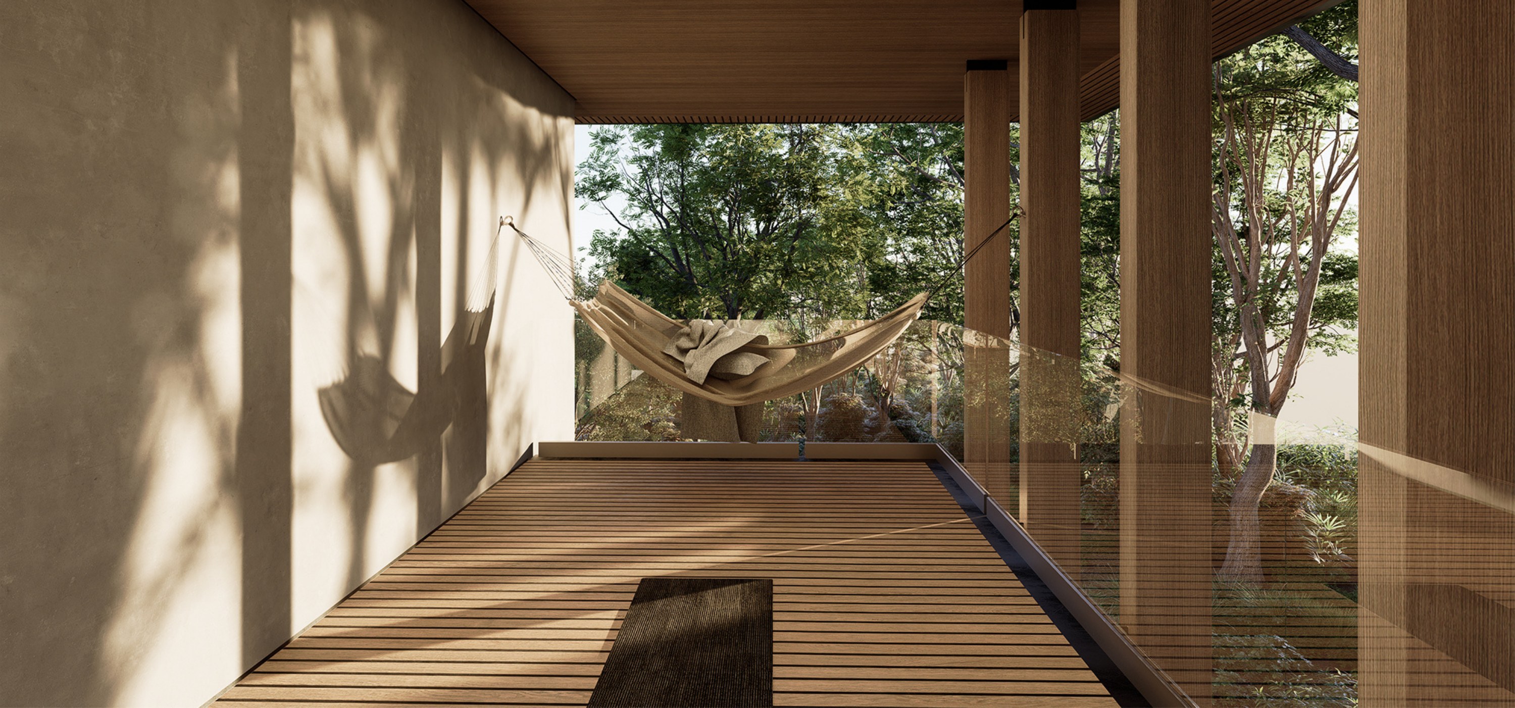 Wooden deck with a hammock and long shadows, open to the tree canopy