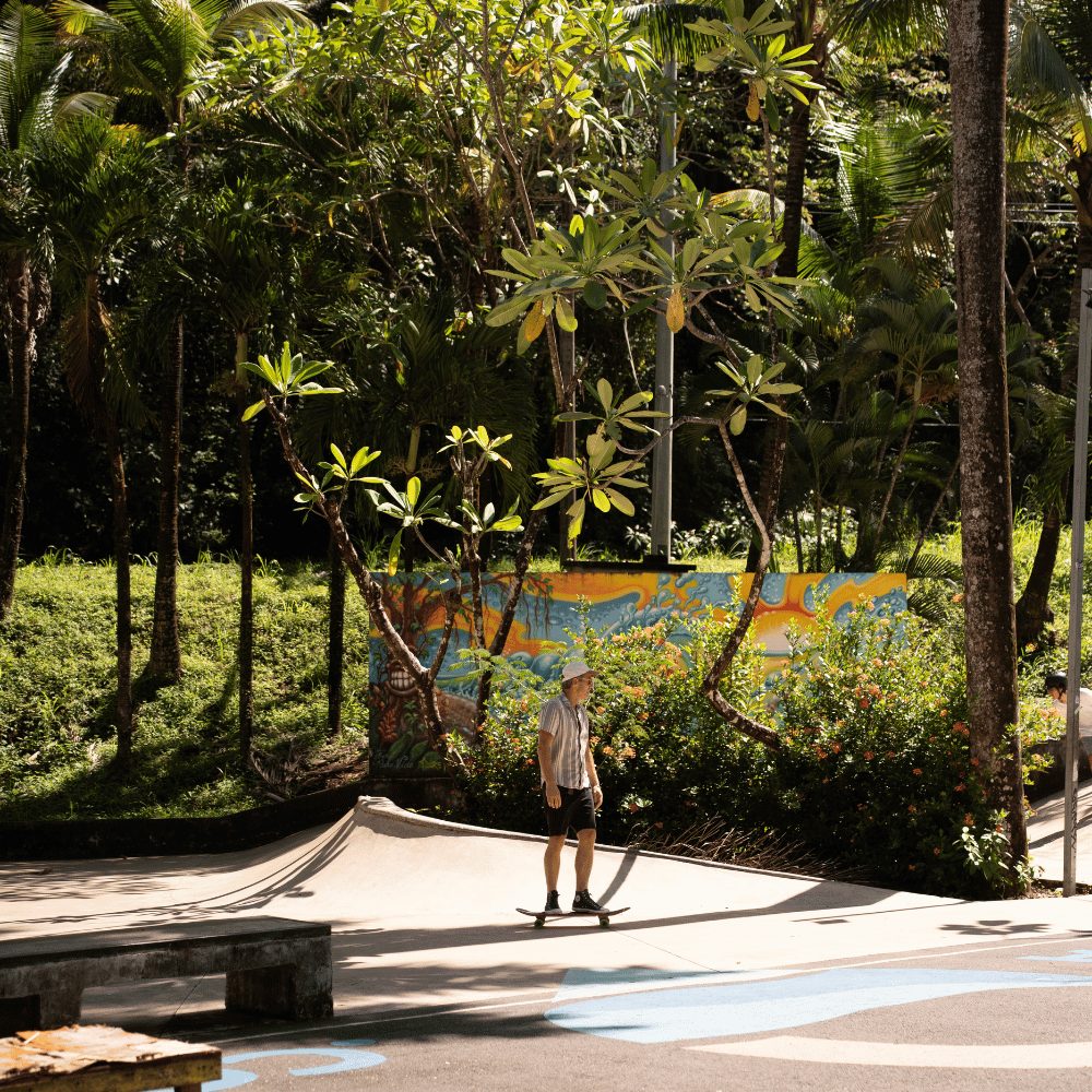 Skateboarding under the palms in Nosara